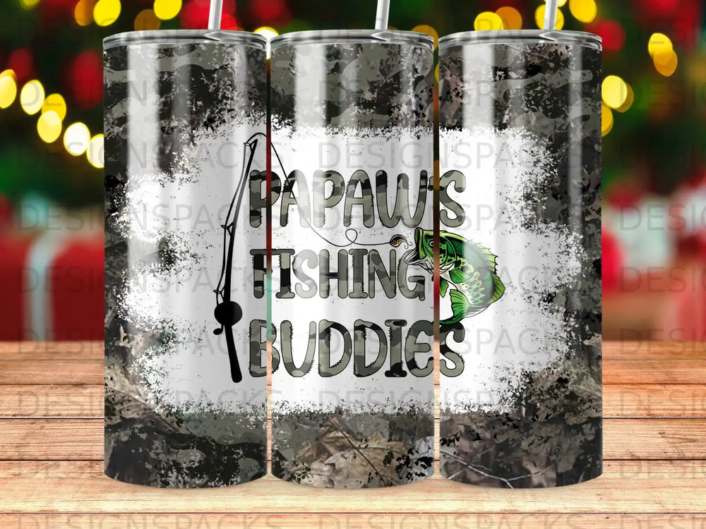 Camouflage tumbler with "Paw's Fishing Buddies" text and a bass fish illustration.