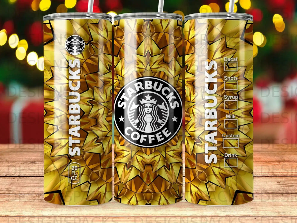 Starbucks tumbler with gold starburst pattern and coffee cup logo.