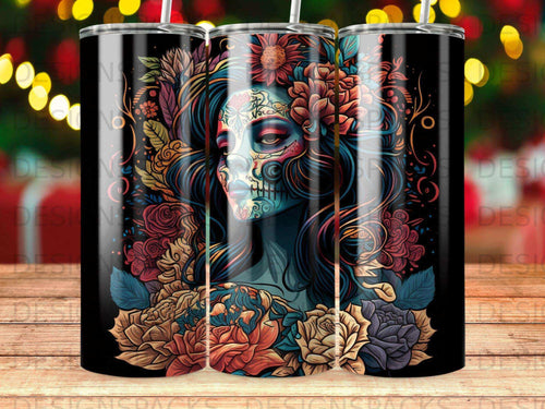 Sugar skull woman with floral headdress and vibrant colors on a black tumbler.