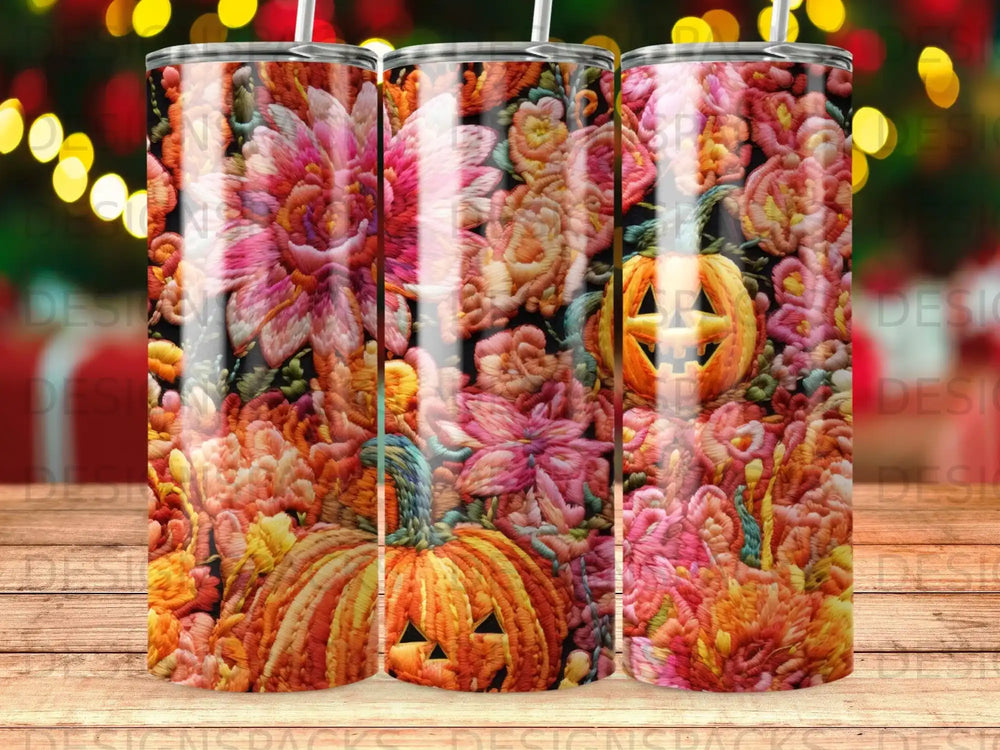Three tumblers with a floral and pumpkin design.