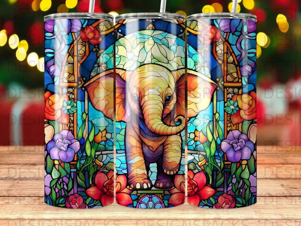 Stained glass elephant surrounded by colorful flowers and ornate framing.