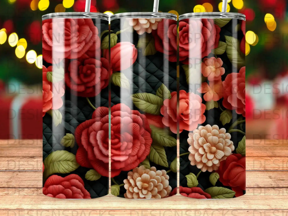 Three tumblers with a dark background and large red and cream floral pattern.