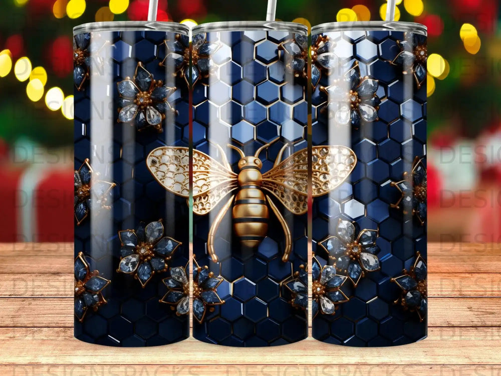 Tumbler with gold bee and blue floral accents on hexagonal background.