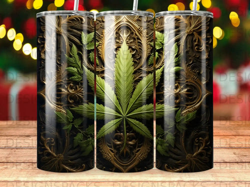Cannabis leaf on ornate gold and black patterned tumbler.