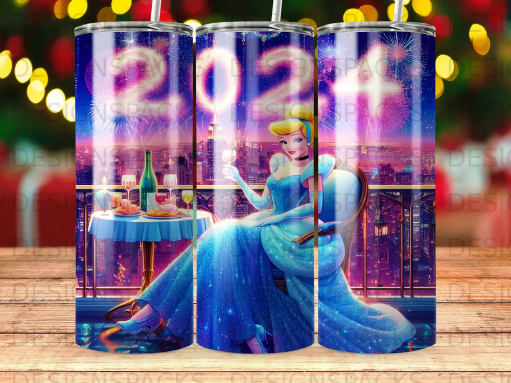 Woman in blue gown seated at a table with fireworks behind her.