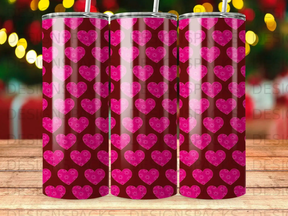 Pink hearts pattern on a dark red tumbler.