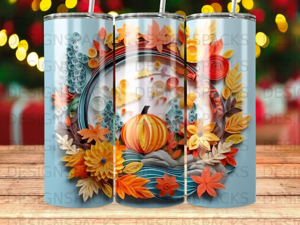 Autumnal quilled paper art on a light blue tumbler with a pumpkin and colorful leaves.