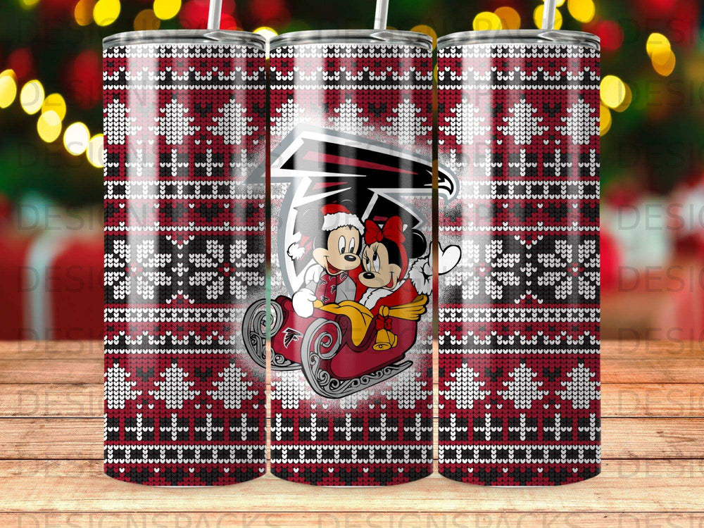 Mickey and Minnie Mouse on a sled, wrapped in a Christmas sweater pattern tumbler.