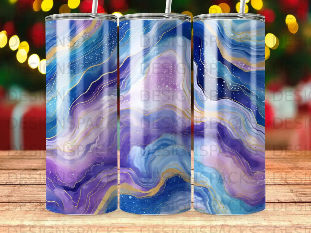 Tumbler with abstract blue, purple, and gold marbled pattern.