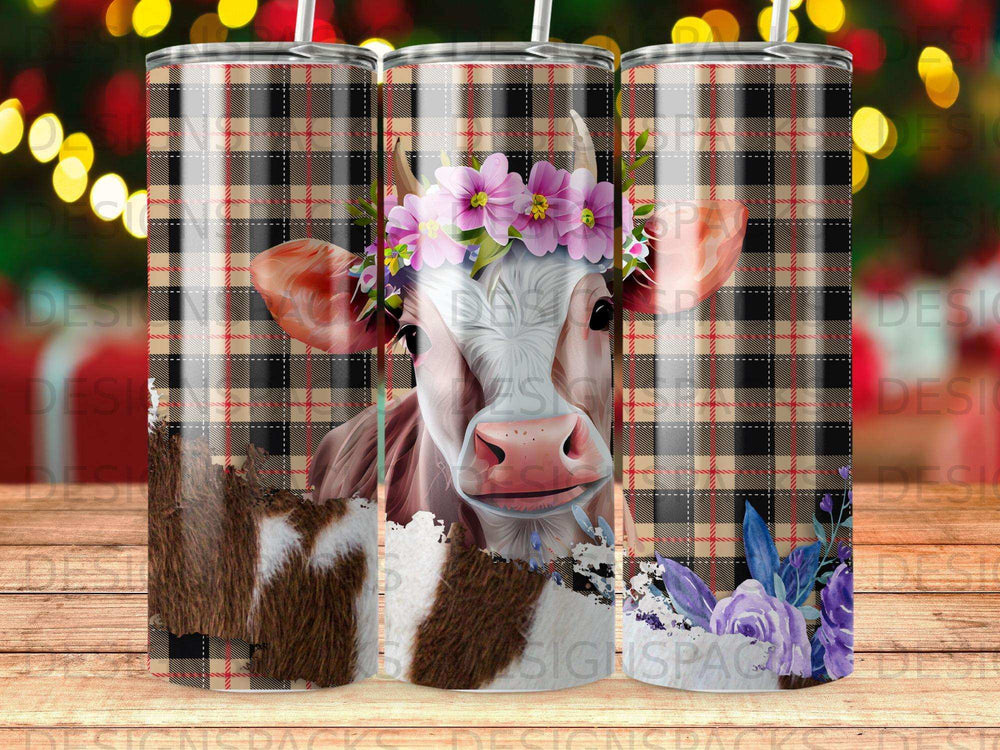 Cow with floral crown and plaid background on a tumbler.