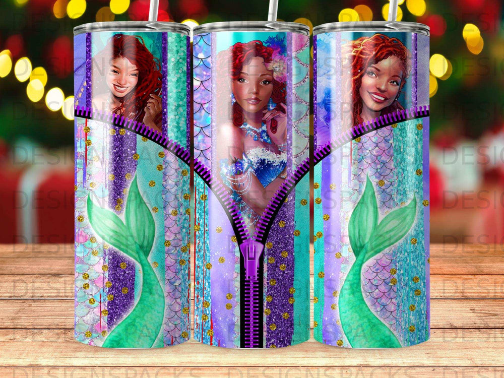 Three mermaid tumblers with purple and teal glitter designs and zippers.