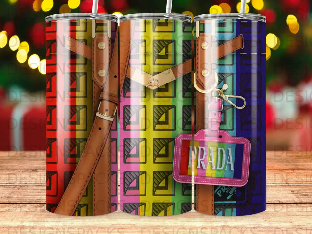 Three tumblers with colorful geometric patterns and Prada logos.