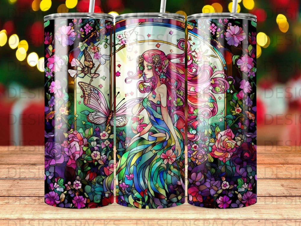 Stained glass tumbler with fairy and floral motifs, archway background.