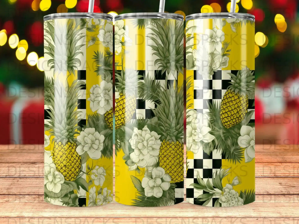 Yellow tumbler with pineapples, white flowers, and black and white checkerboard pattern.