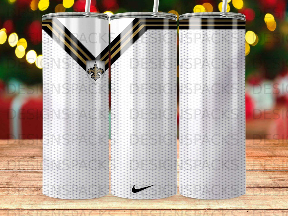 White tumbler with a black and gold chevron pattern and a Saints logo.