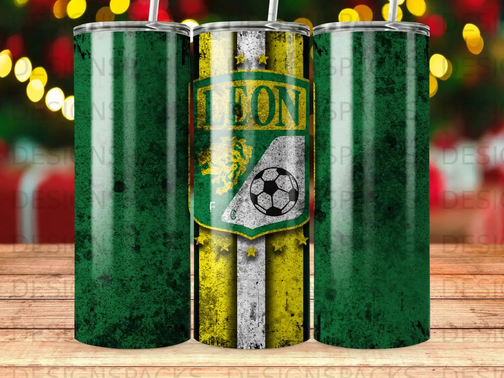 Green distressed tumbler with lion and soccer ball graphic.
