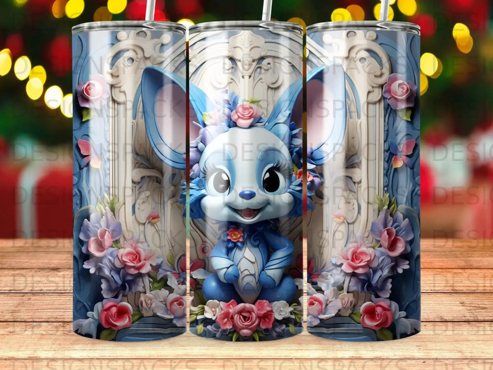 Blue cartoon creature with bunny ears and floral accents on a tumbler.