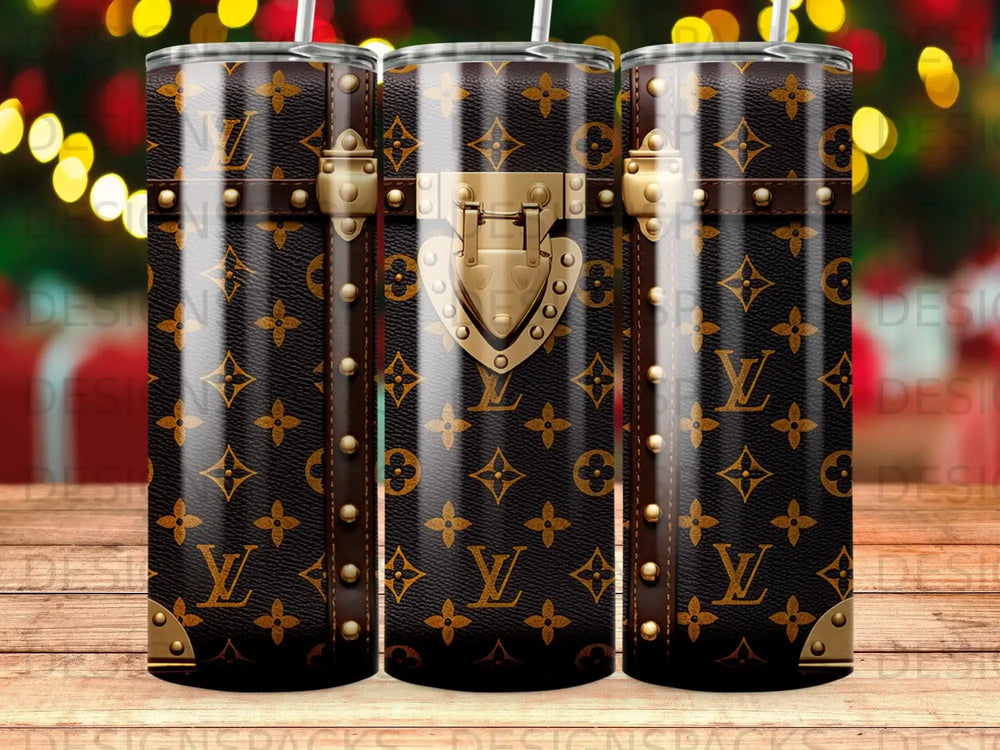 Dark brown tumbler with repeating Louis Vuitton monogram pattern and gold hardware accents.
