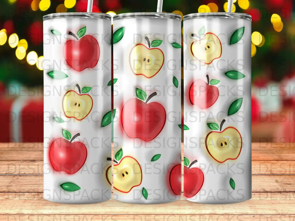Tumbler with repeating pattern of red and yellow apples and green leaves.
