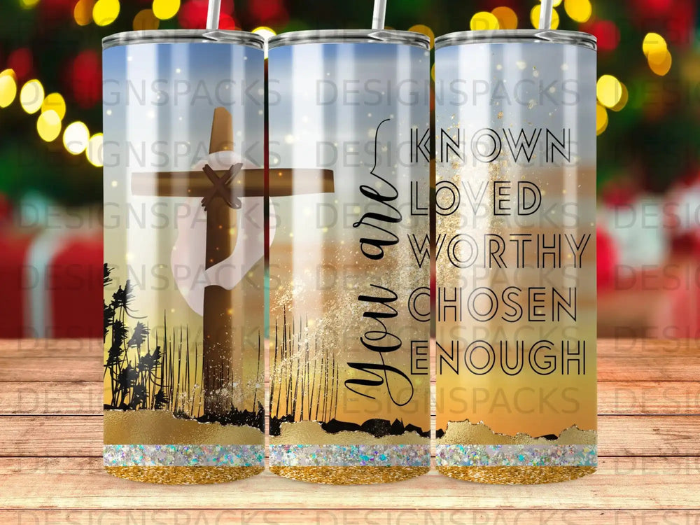 Tumbler with "You are known, loved, worthy, chosen, enough" text and cross silhouette.