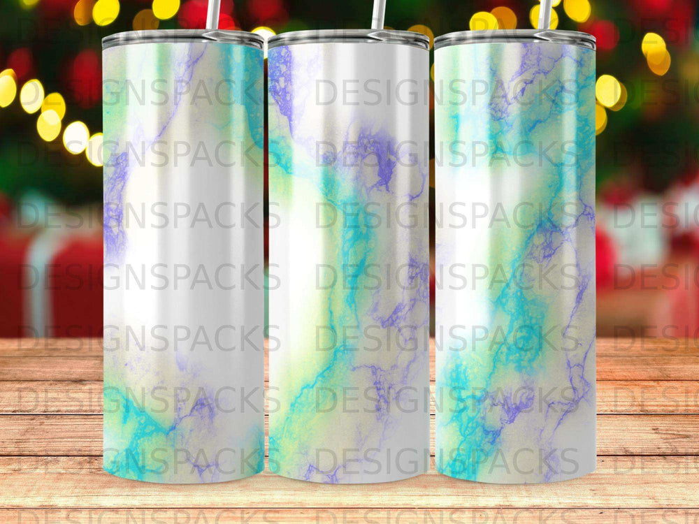 Three tumblers with a marbled blue, green, and purple design.