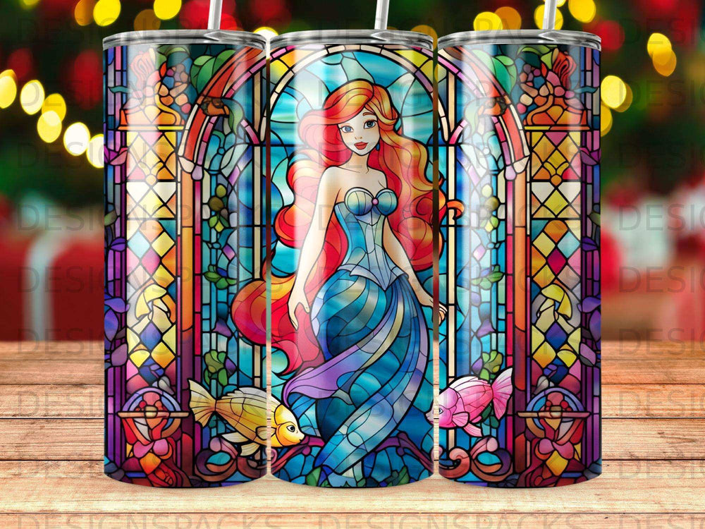 Ariel from The Little Mermaid in a stained glass window with two fish.