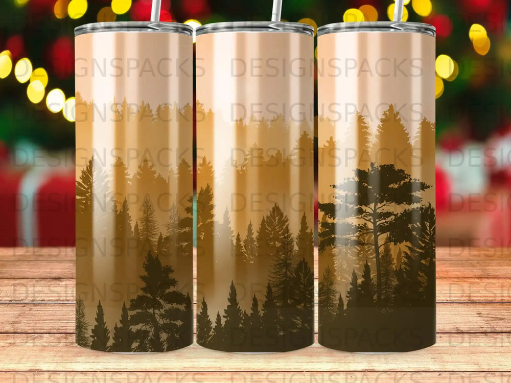Three tall, slim tumblers with a forest silhouette design in gradient tones.