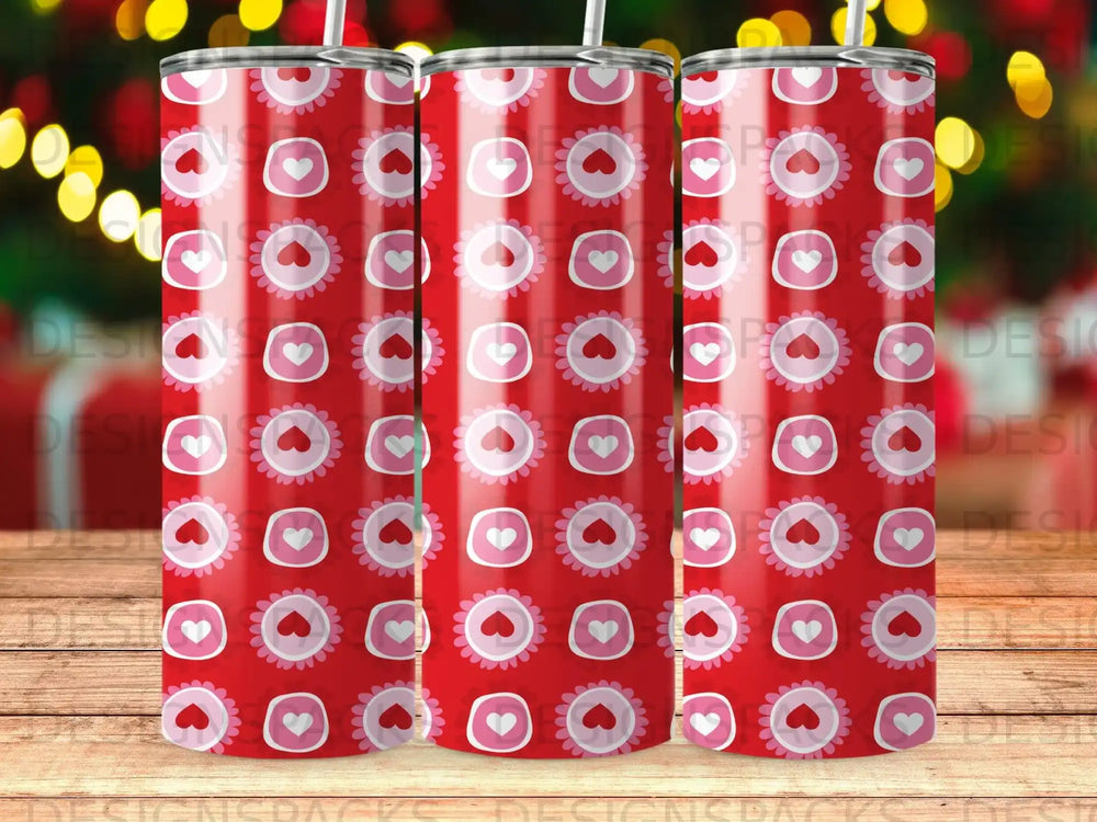 Red tumbler with repeating pattern of hearts and circles.