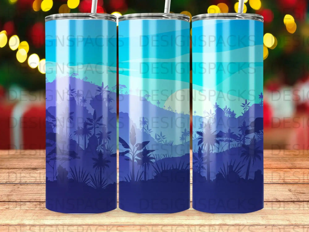Blue forest silhouette tumbler with straw on white background.