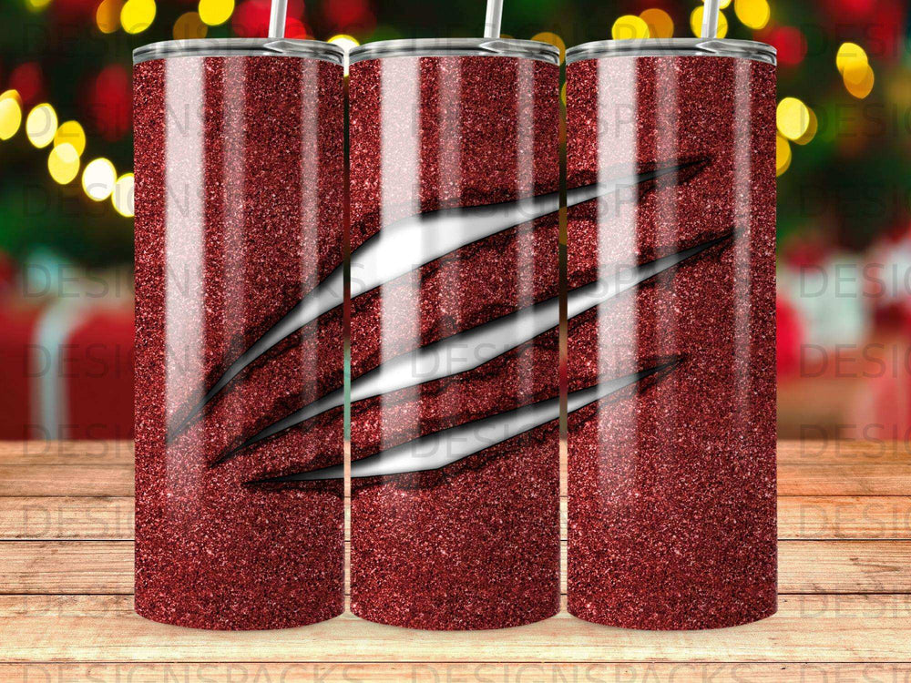 Red glitter tumbler with black claw marks design.