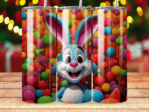 Blue bunny with pink ears and nose among colorful candy balls on a striped background.