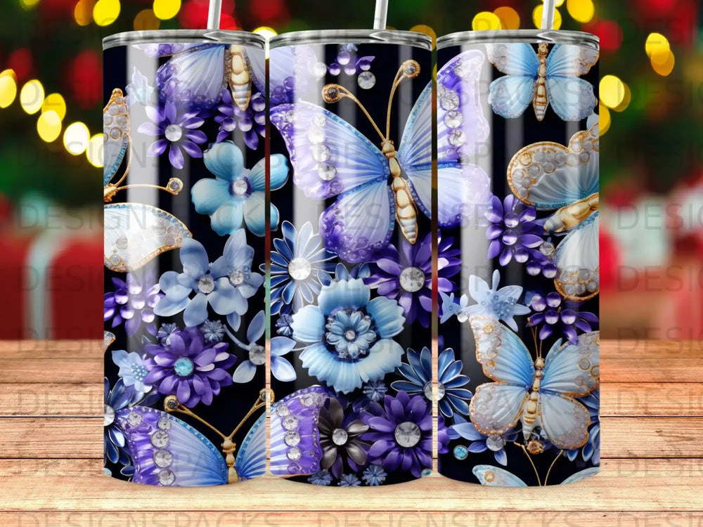 Three tumblers with purple butterflies, flowers, and gems.
