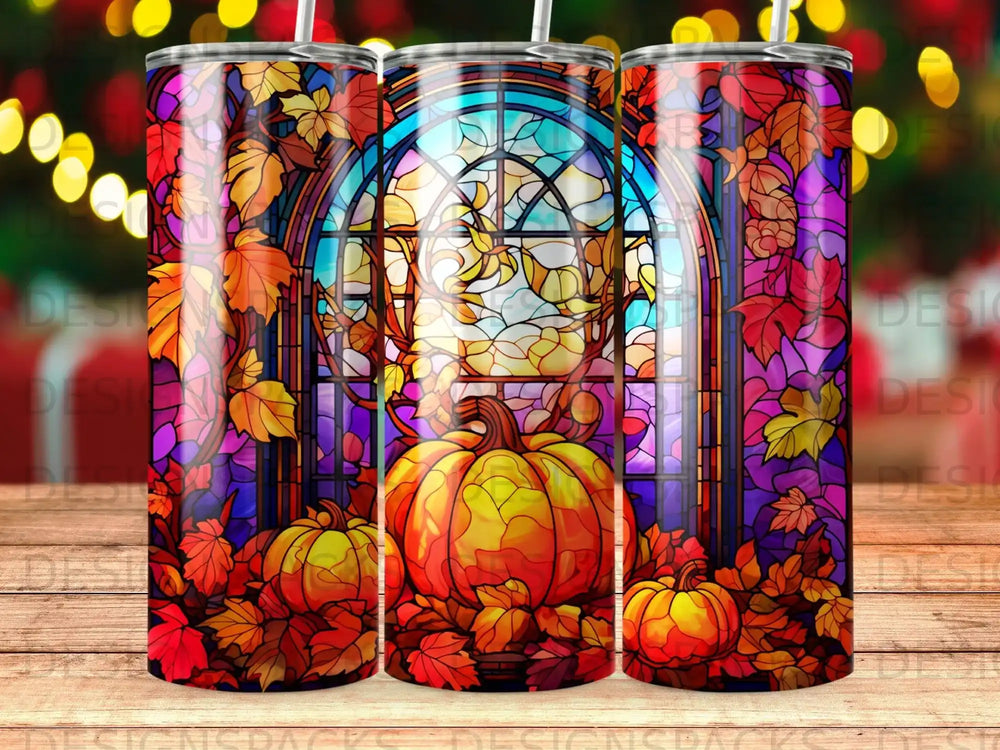 Autumn stained glass window with pumpkins and colorful fall leaves.