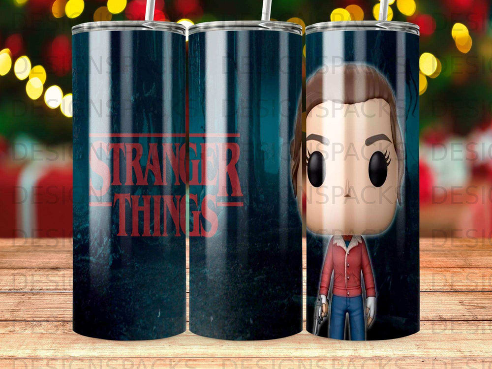 Stranger Things tumbler with character Eleven and forest background.