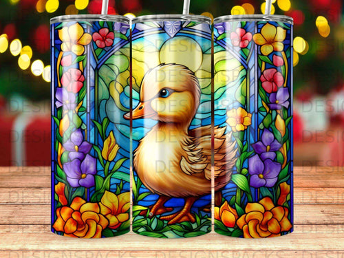 Stained glass duckling surrounded by colorful flowers and foliage.