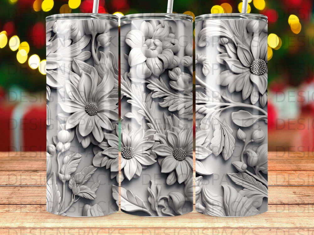 3D embossed floral design with daisies and leaves on a tumbler.