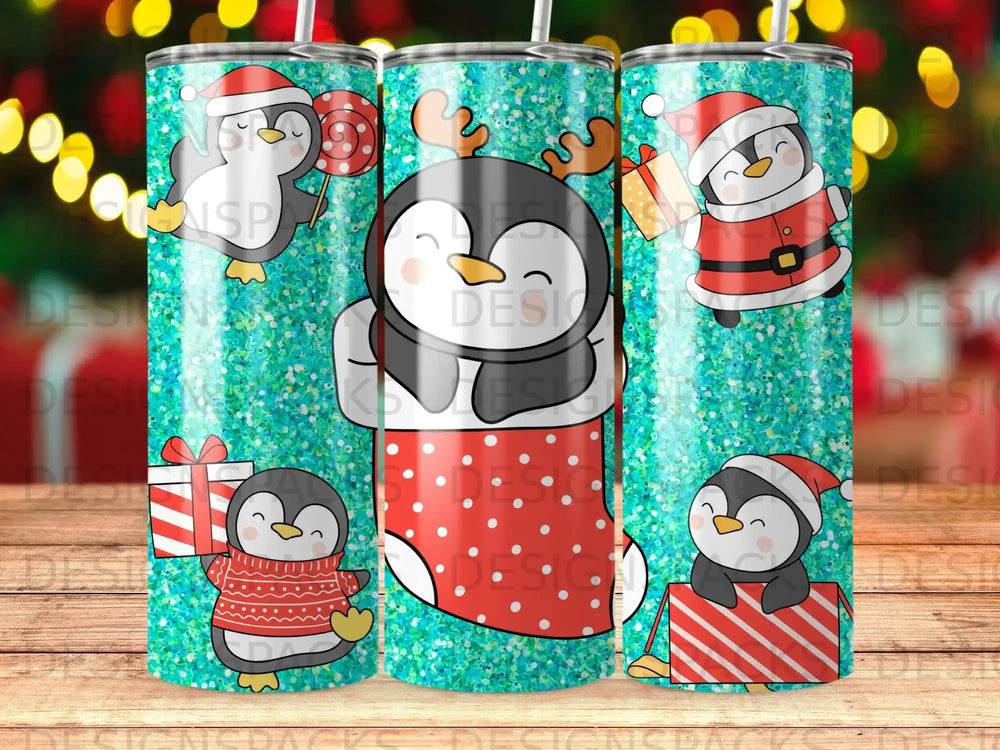 Three skinny tumblers featuring cartoon penguins in festive Christmas attire.