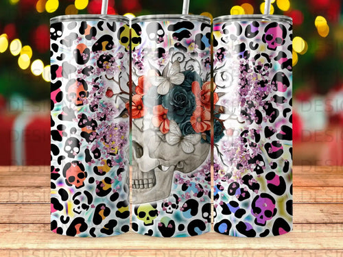 Tumbler with skull, flowers, and leopard print design.