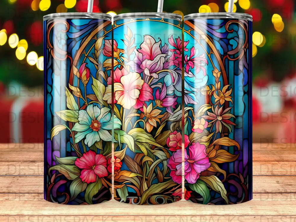 Floral stained glass design on a cylindrical tumbler with bokeh lights.