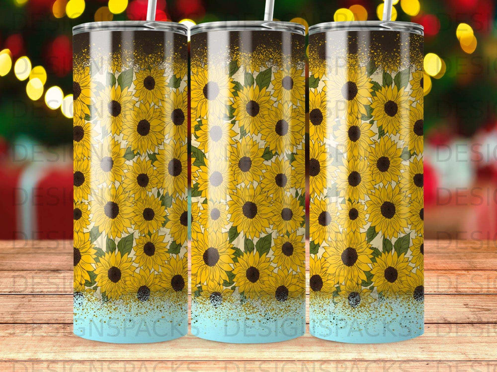 Tumbler with repeating sunflower pattern and glittery blue base.