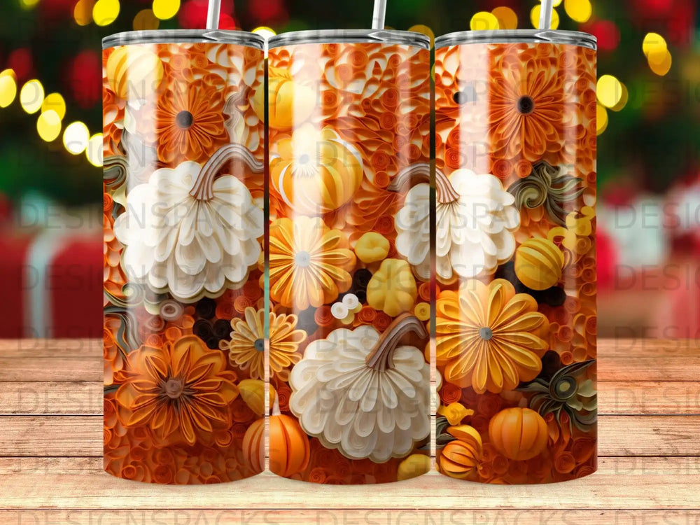 Orange and white pumpkins with floral accents on a patterned tumbler.