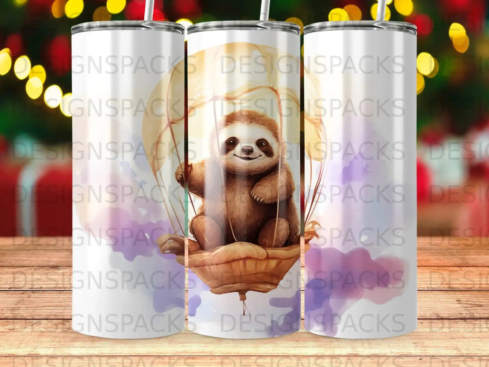 Sloth in basket with watercolor clouds, "DESIGNSPACKS" watermark.