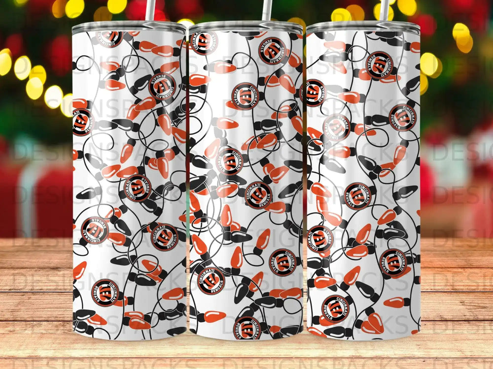 Cincinnati Bengals logo pattern on white tumblers with festive lights.
