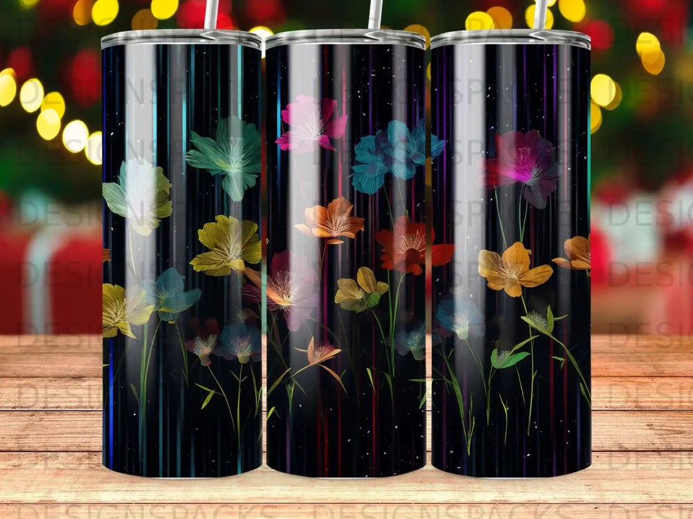 Tall tumbler with colorful, transparent flowers against a dark, striped background.