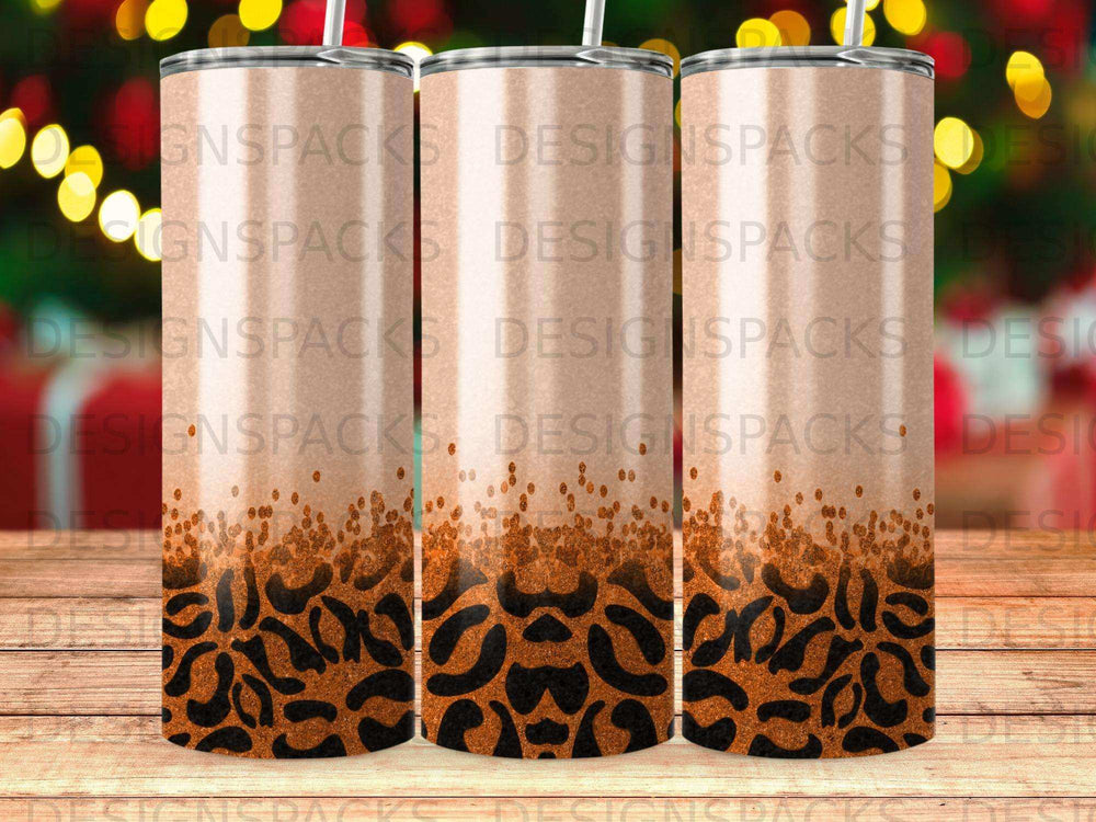 Three tumblers with leopard print and glitter detail.