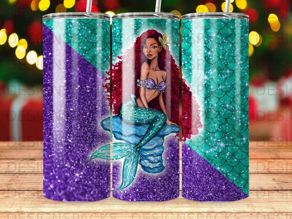 Mermaid with long red hair sitting on a blue seashell, surrounded by glitter.