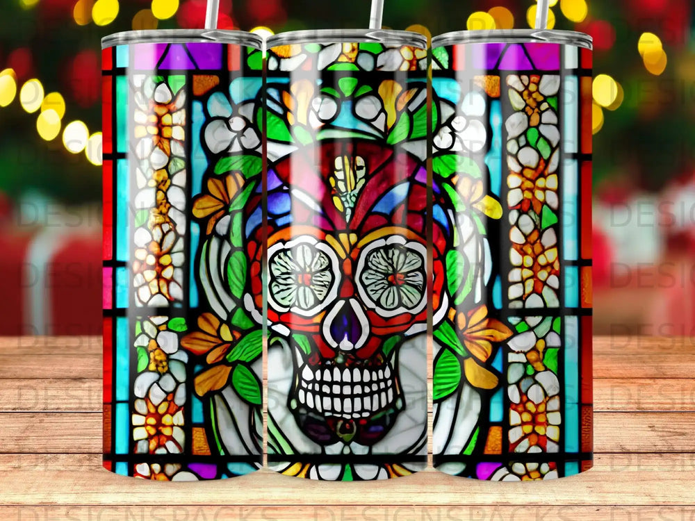 Stained glass skull with floral accents on a tumbler.