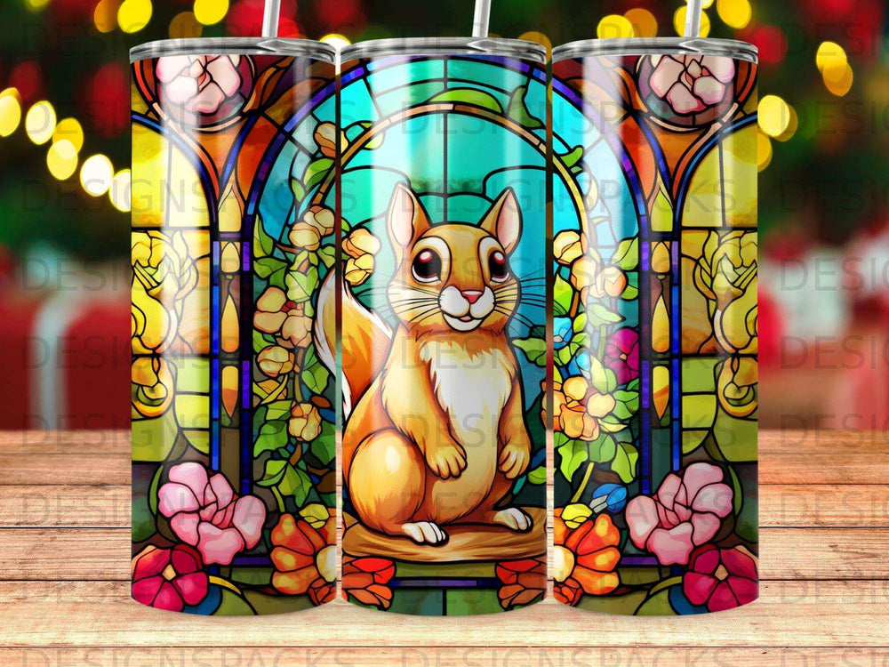 Stained glass tumbler with a squirrel surrounded by colorful flowers and foliage.