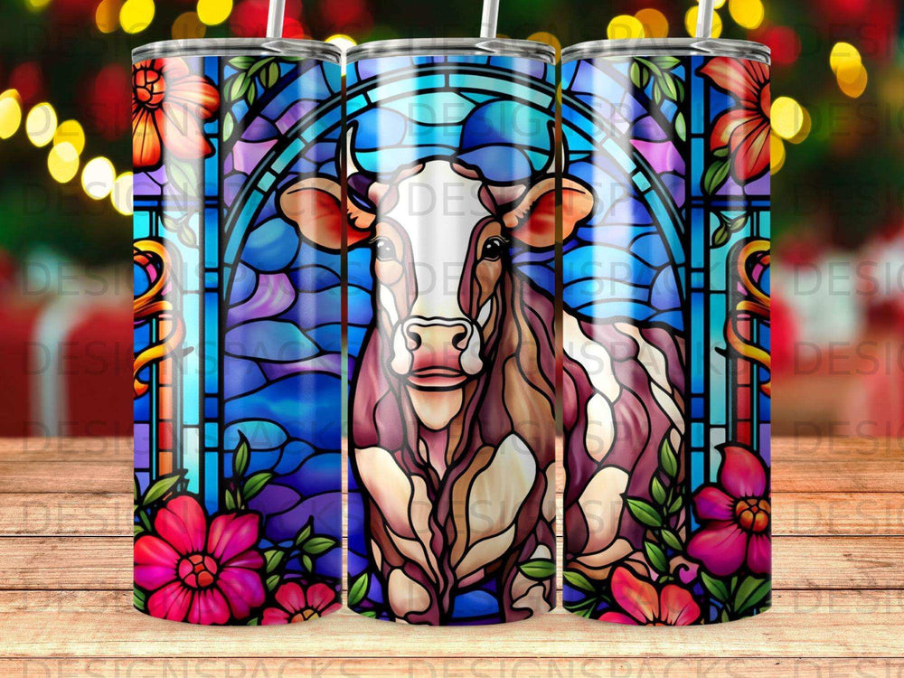 Stained glass cow with pink flowers on a blue background.