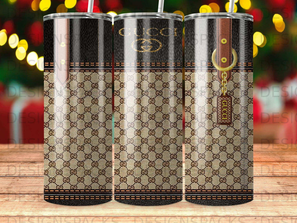 Gucci print tumbler with gold accents and hanging tag.